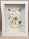 Blue Ocean Collection – Sea Glass & Shell Specimen Frame

Inspired by the vibrant colors of the ocean, this one-of-a-kind specimen frame features genuine seashells, coral, starfish, and striking blue sea glass.

Each element is thoughtfully arranged to hi